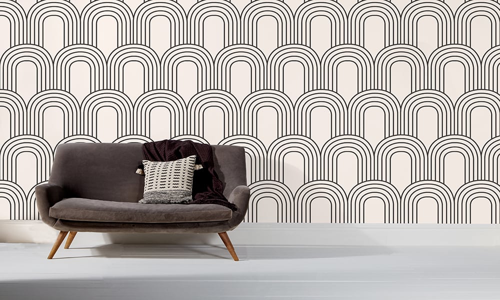 Black and white geometric large arch shaped wallpaper in a living room 