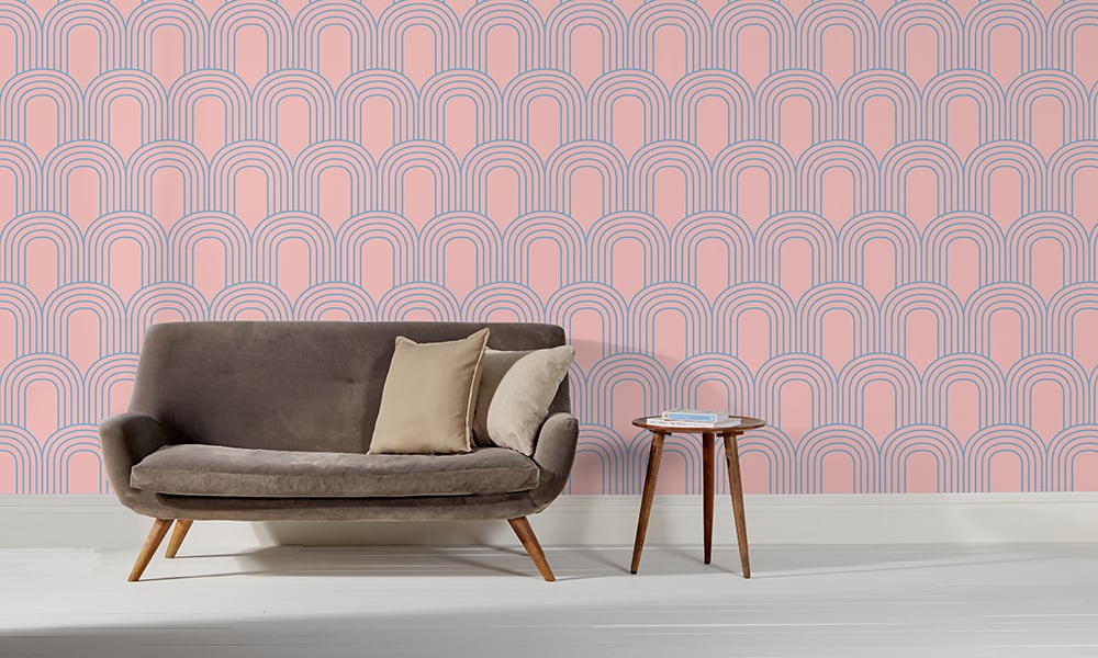 Pink arch shaped geometric wallpaper in medium sized pattern in a living room