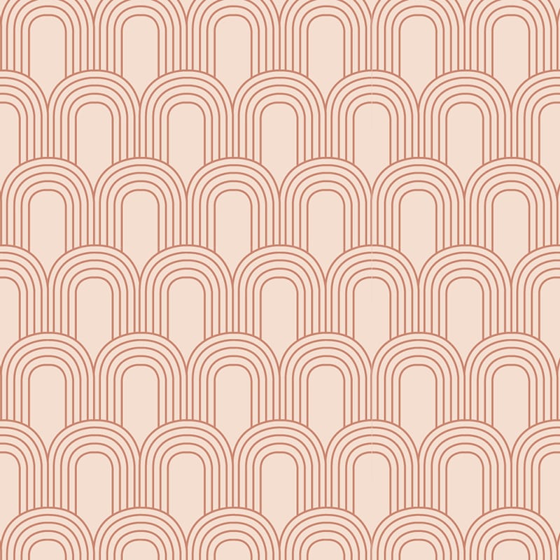 Pastel pink background with terracotta arch pattern wallpaper in a living room
