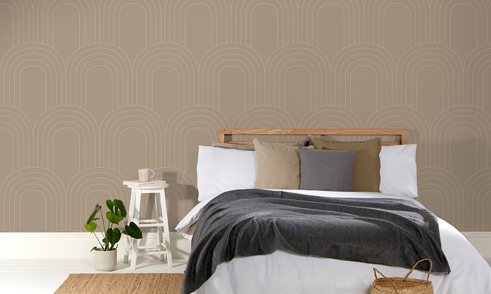 Bedroom wallpaper with large-scale arch pattern in taupe colour