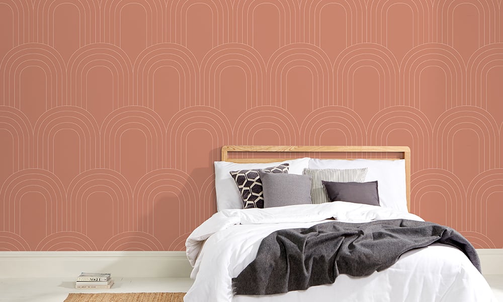 Orange earthy retro-style arch-shaped wallpaper design in a bedroom 