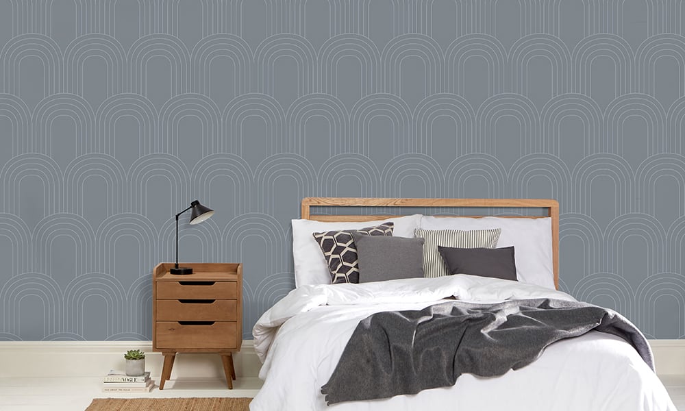 Blue retro-style loop wallpaper in a bedroom setting