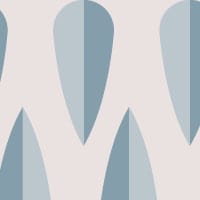 Retro arrow shaped wallpaper design in blue tones in a living room setting