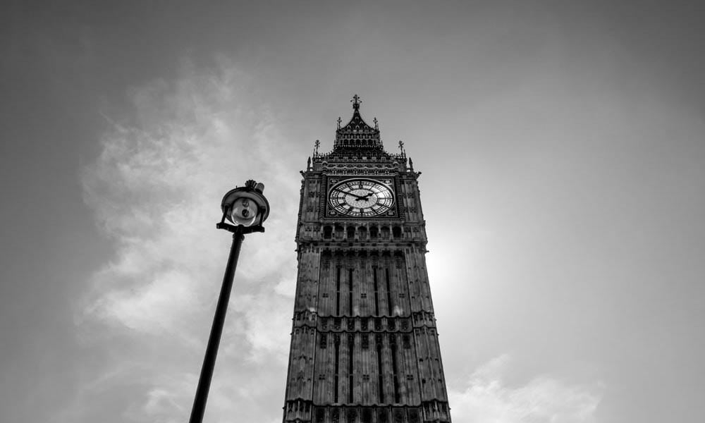 Black and white low-angled image of Big Ben in London