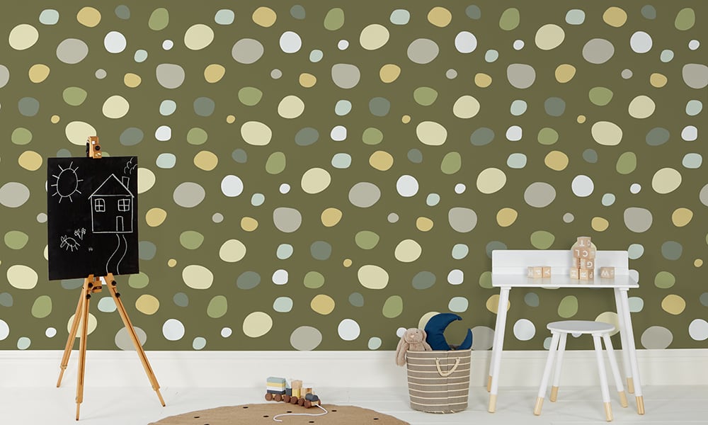 Fun green dotty print wallpaper in a large size pattern in a kid's bedroom