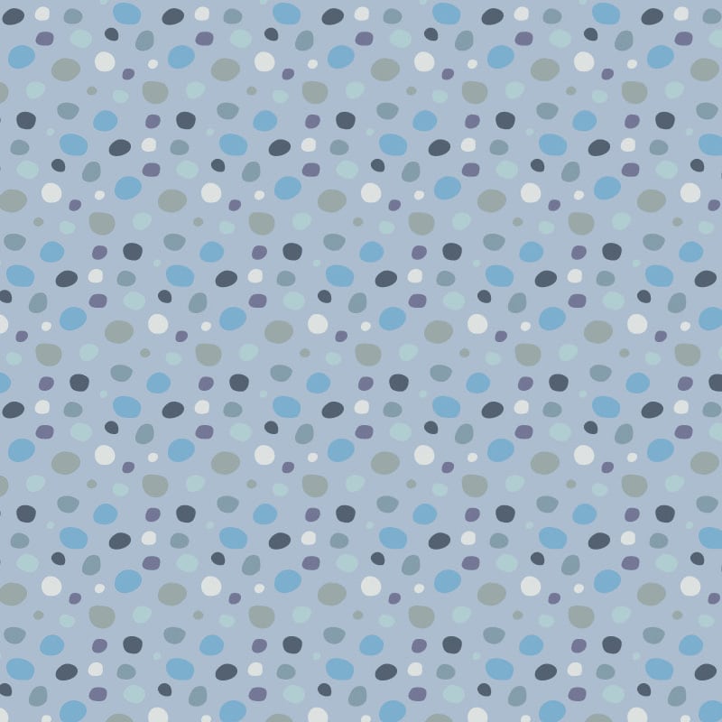Dotty wallpaper design in various blue colours in a child's bedroom 