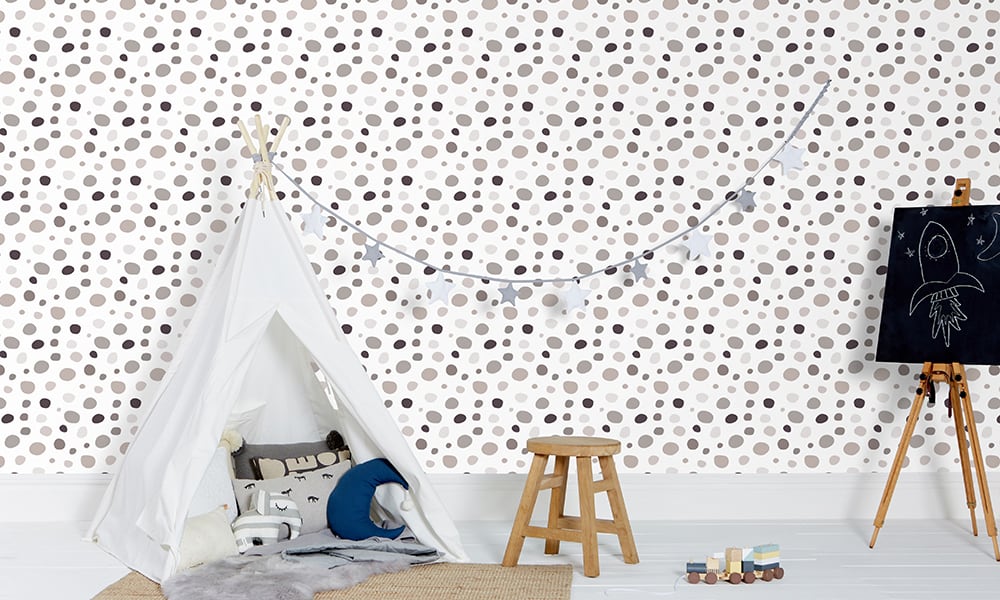 Modern medium-sized dotty print wallpaper in white and grey colours in a child's bedroom