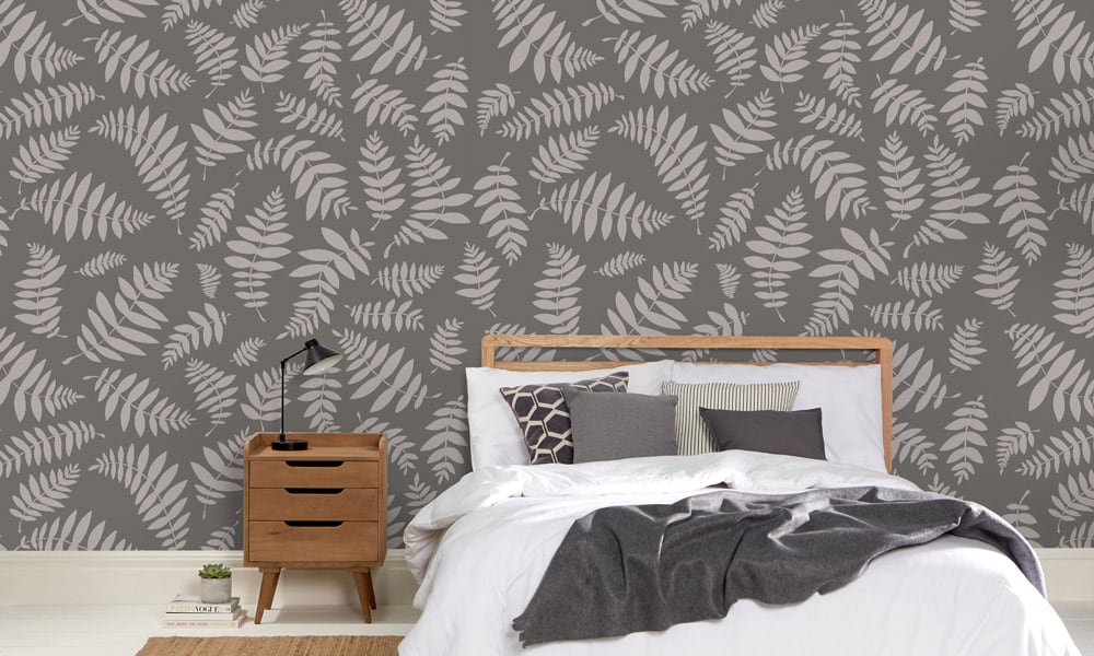 Grey leafy botanical wallpaper in a scandi style bedroom 