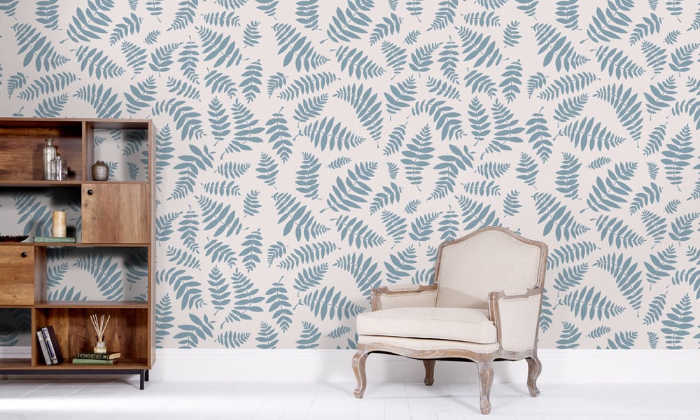 Blue bracken leaf wallpaper in a medium-sized pattern in a living room