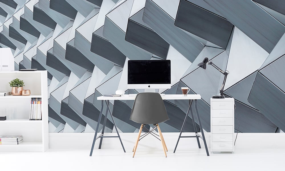 Office with a desk and grey arcitecture wallpaper
