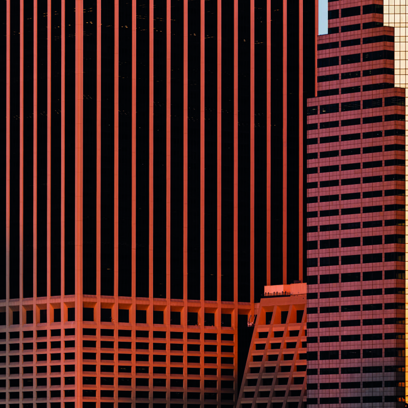 Living room with urban skyscraper wallpaper in orange and black colours