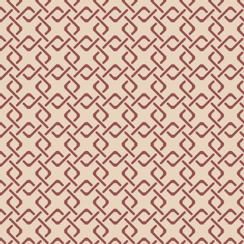 Red geometric pattern wallpaper with neutral background colour in a lounge 