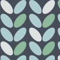 Blue and teal coffee bean pattern wallpaper with a grey chair