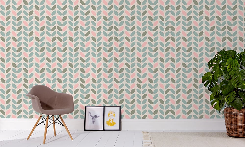 Blue, pink and green pastel coloured wallpaper in a medium-sized pattern with a grey chair
