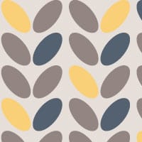 Modern wallpaper design in grey with navy and yellow accent colours in a living space with a grey chair