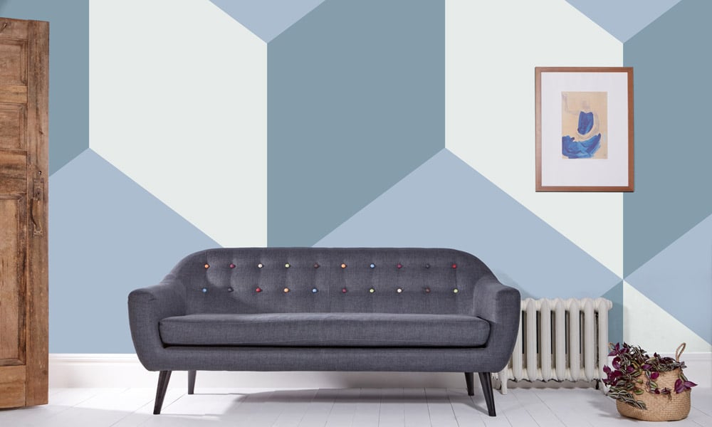 Modern living room with grey sofa and picture on wall 