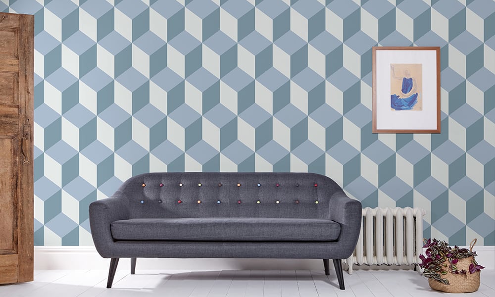 Contemporary large scale cube-shaped wallpaper pattern in blue tones in a living room