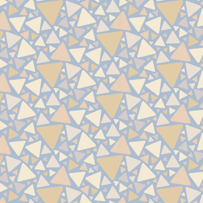 Triangular pattern wallpaper in blue and neutral colour tones with a grey chair