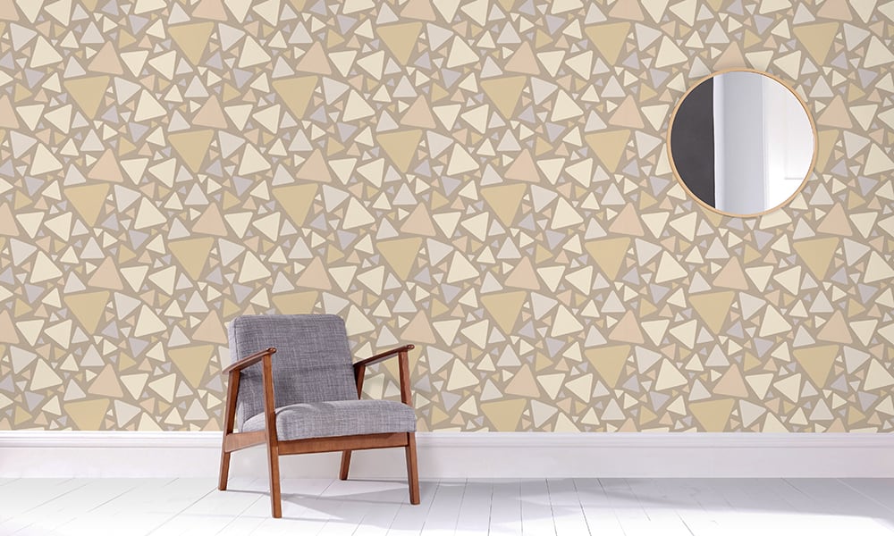Medium-sized triangular pattern in a teal and grey colour tones in a living room with grey chair