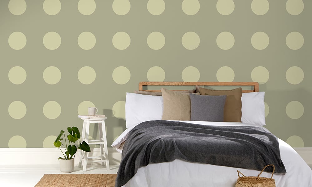 Large-scale dotty pattern in a khaki green colour in a bedroom