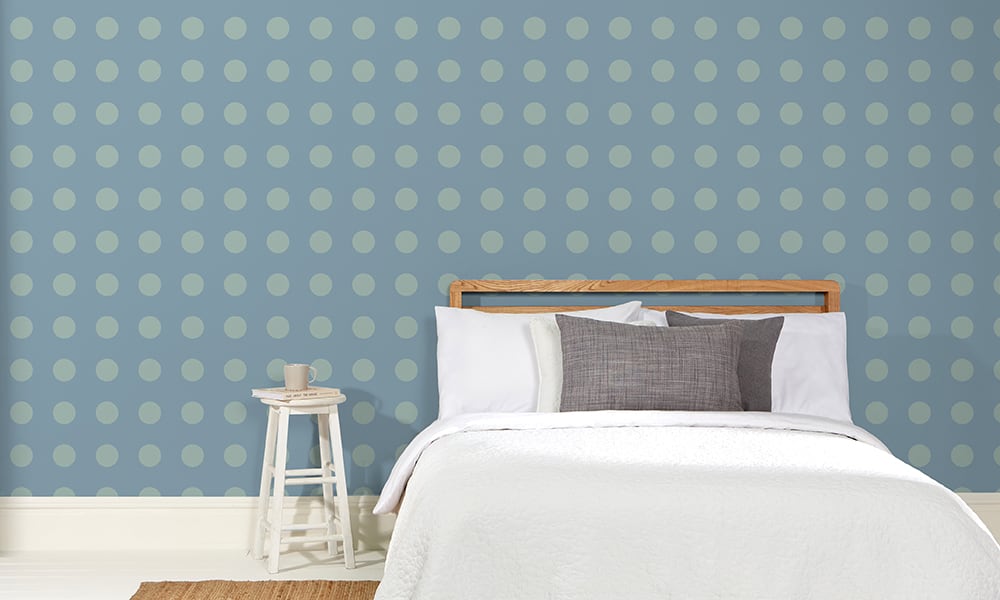 Blue polka dot in a medium-sized pattern in a bedroom setting