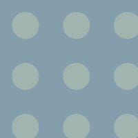Polka dot pattern wallpaper in a blue colour palette in a bedroom setting