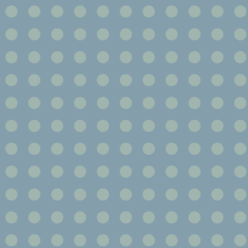 Polka dot pattern wallpaper in a blue colour palette in a bedroom setting