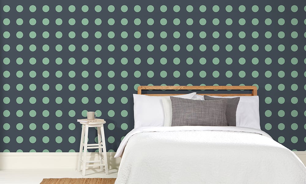 Navy and green spot wallpaper pattern in a bedroom