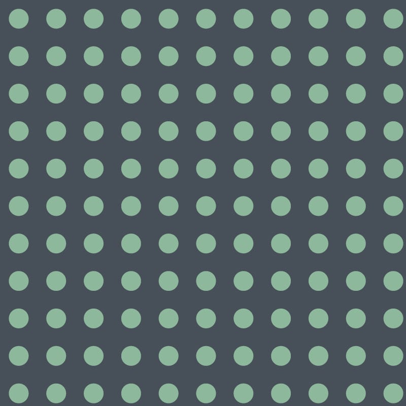 Navy and green dotty wallpaper pattern in a bedroom 