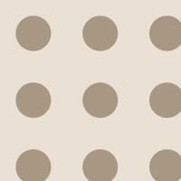 Neutral polka dot patterned wallpaper in a bedroom setting