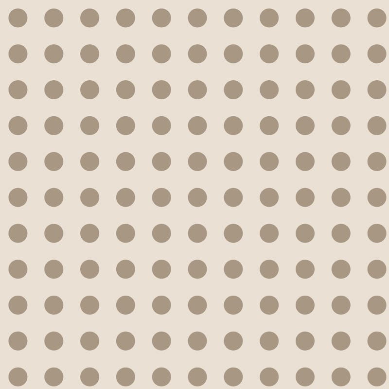 Neutral polka dot patterned wallpaper in a bedroom setting