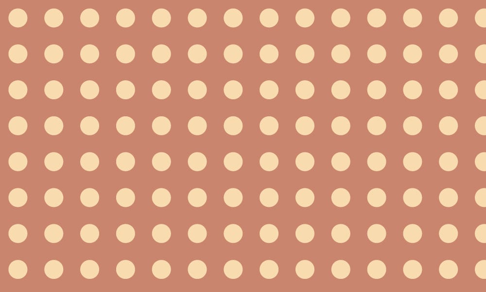 Polka dot pattern wallpaper in terracotta orange