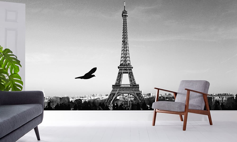 Eiffel tower wall mural in a living room with grey chair