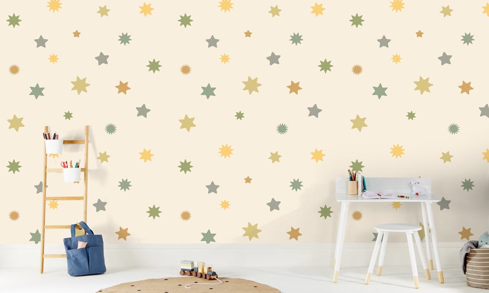 Large-scale starry wallpaper in green and yellow in a kid's bedroom