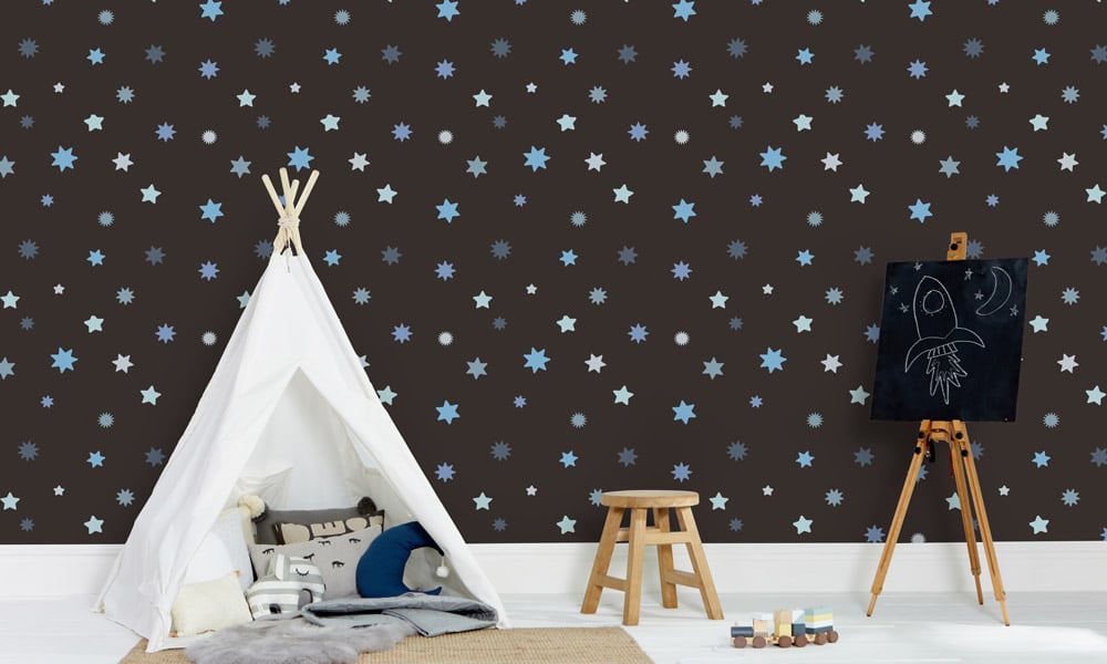 Blue star wallpaper with a black background in child's bedroom