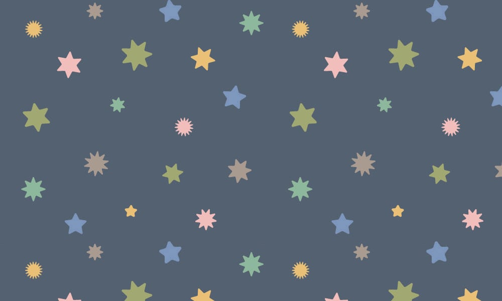 Navy blue wallpaper with pastel coloured stars 