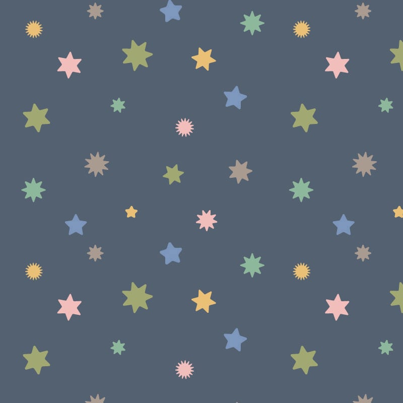 Pastel coloured starry wallpaper in a kid's bedroom