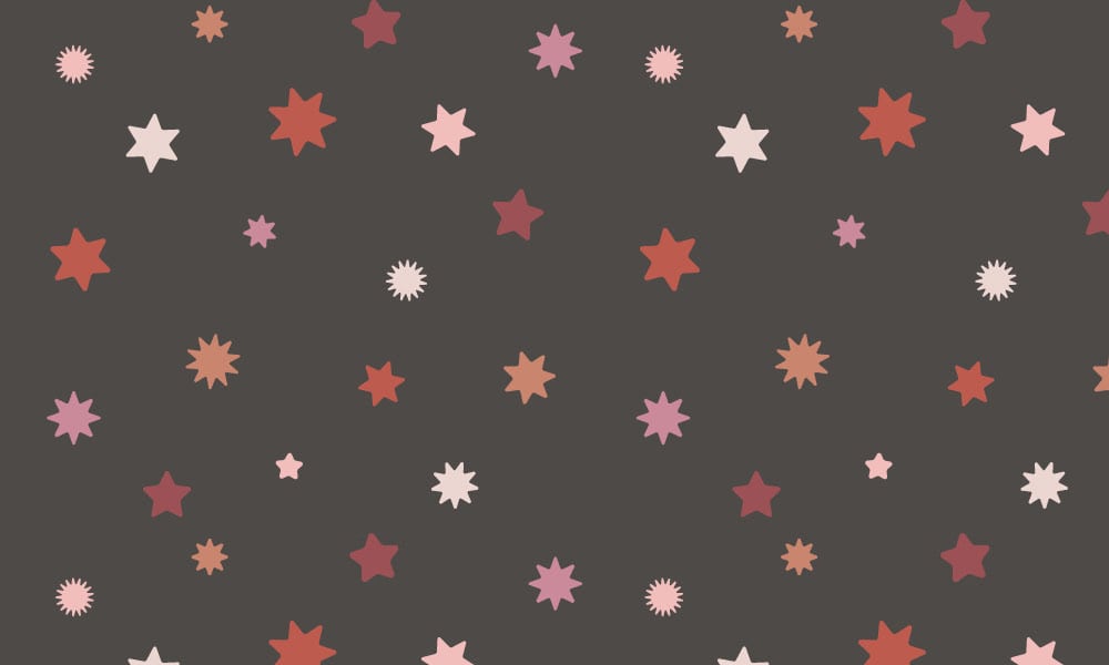 Girlie star wallpaper with a dark grey background and red and pink stars