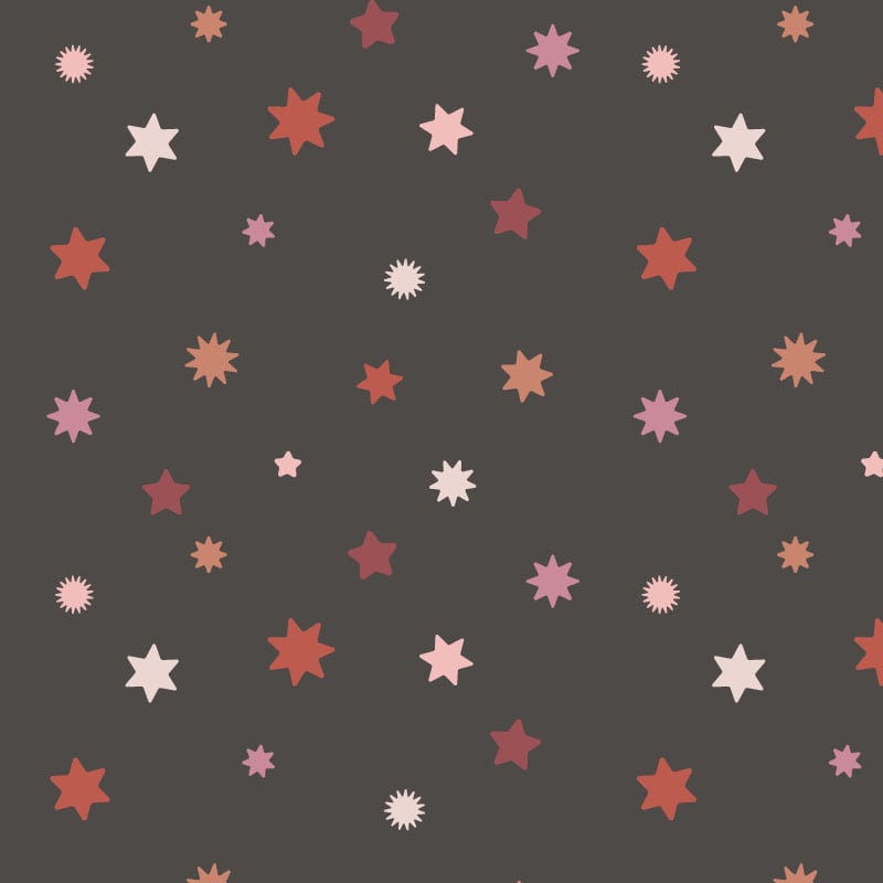 Dark night sky wallpaper with pink and red stars in a child's bedroom