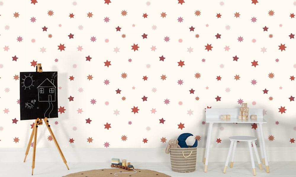 Girlie starry wallpaper with a light background and red and pink stars