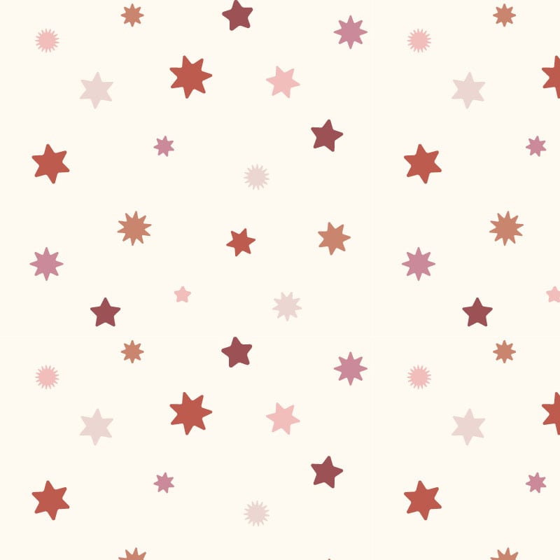 Star wallpaper with a neutral background and pink and red stars in kid's bedroom