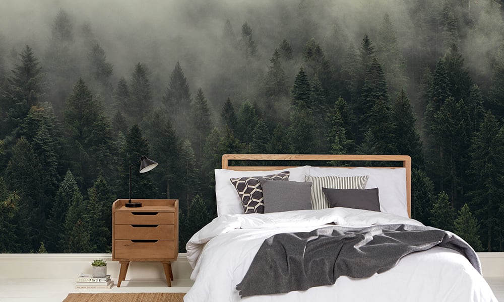 Minimalist style interior bedroom with a misty scene forest wallpaper
