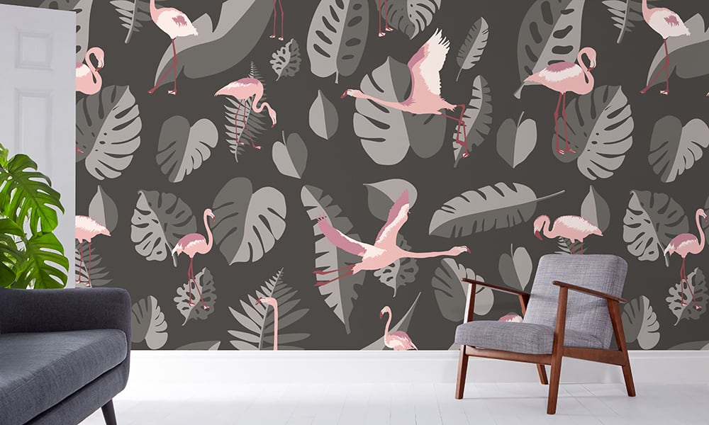 Large-scale dark grey leaf wallpaper with pink flamingos