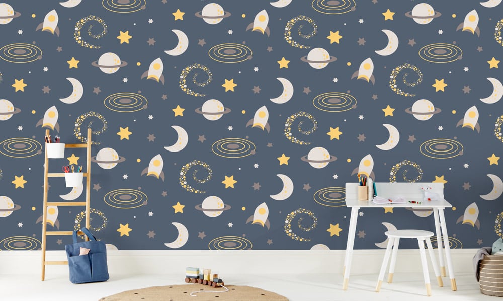 Navy blue space-themed wallpaper in a child's bedroom