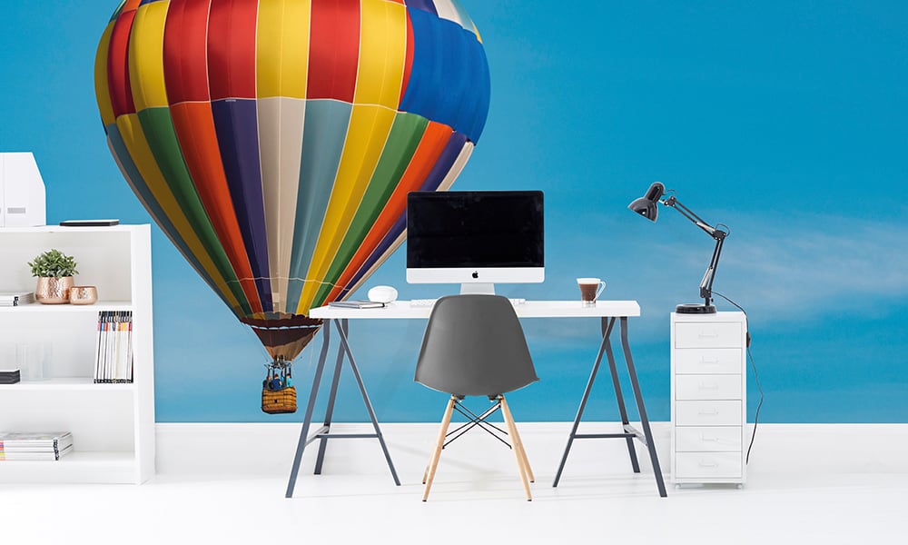 Colourful hot air balloon mural with blue sky in an office setting