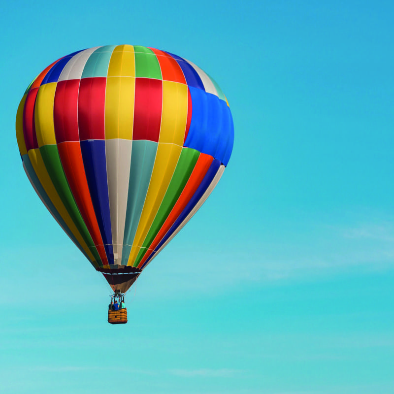 Office scene with a colourful hot air balloon blue sky wallpaper