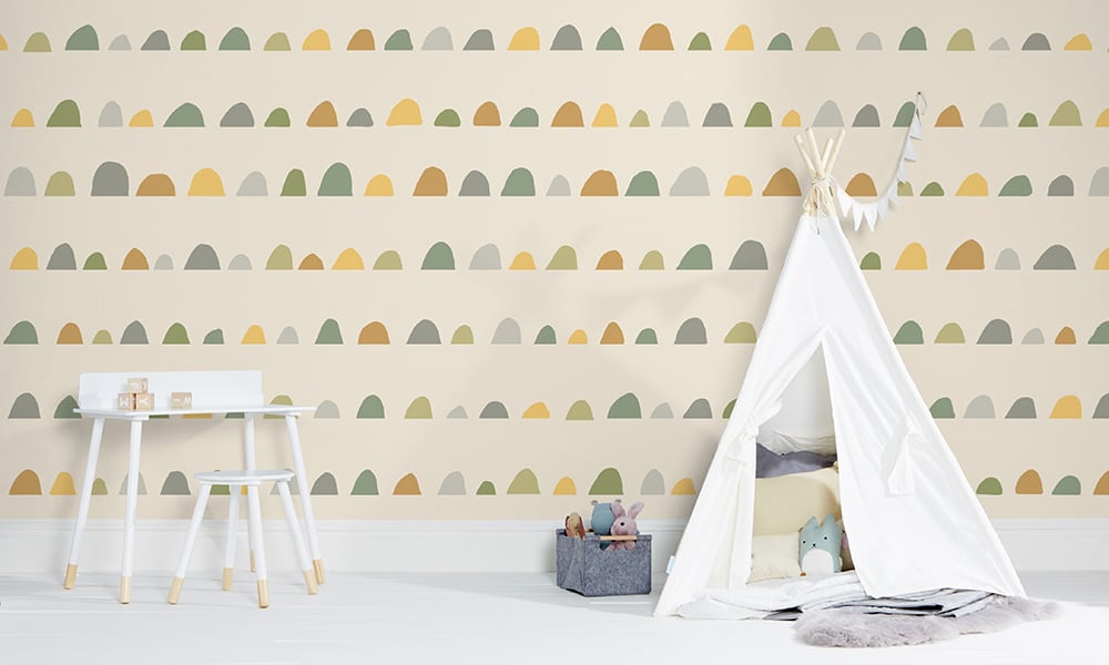Large-scale green humps wallpaper in a child's bedroom  