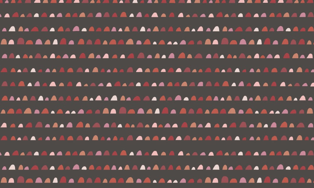 Dark grey wallpaper with red and pink hump pattern 