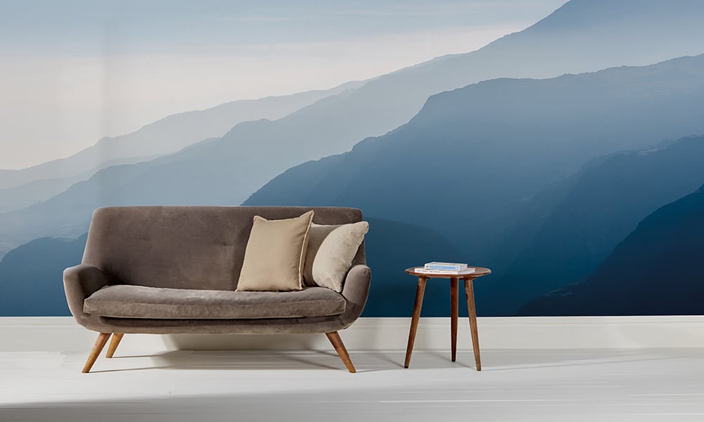 Modern living room with misty mountain range wallpaper