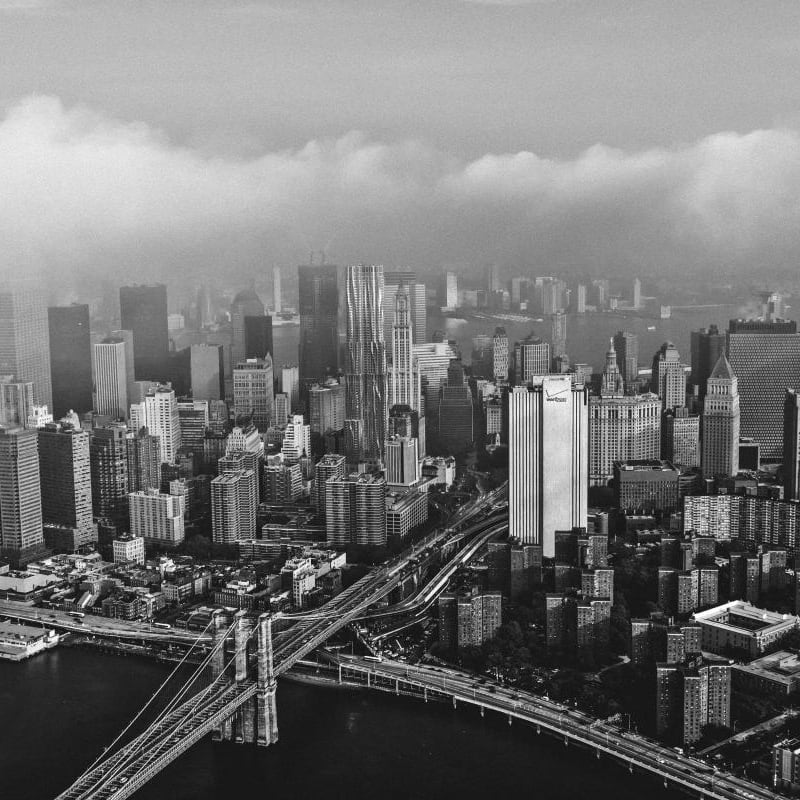 Living room with a black and white photo wall mural of the view of  Manhattan Island New York City
